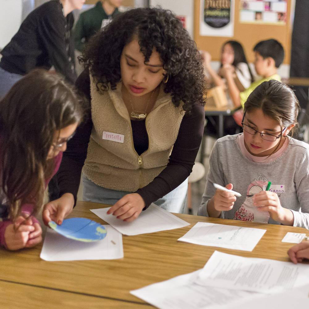 Students working with instructor