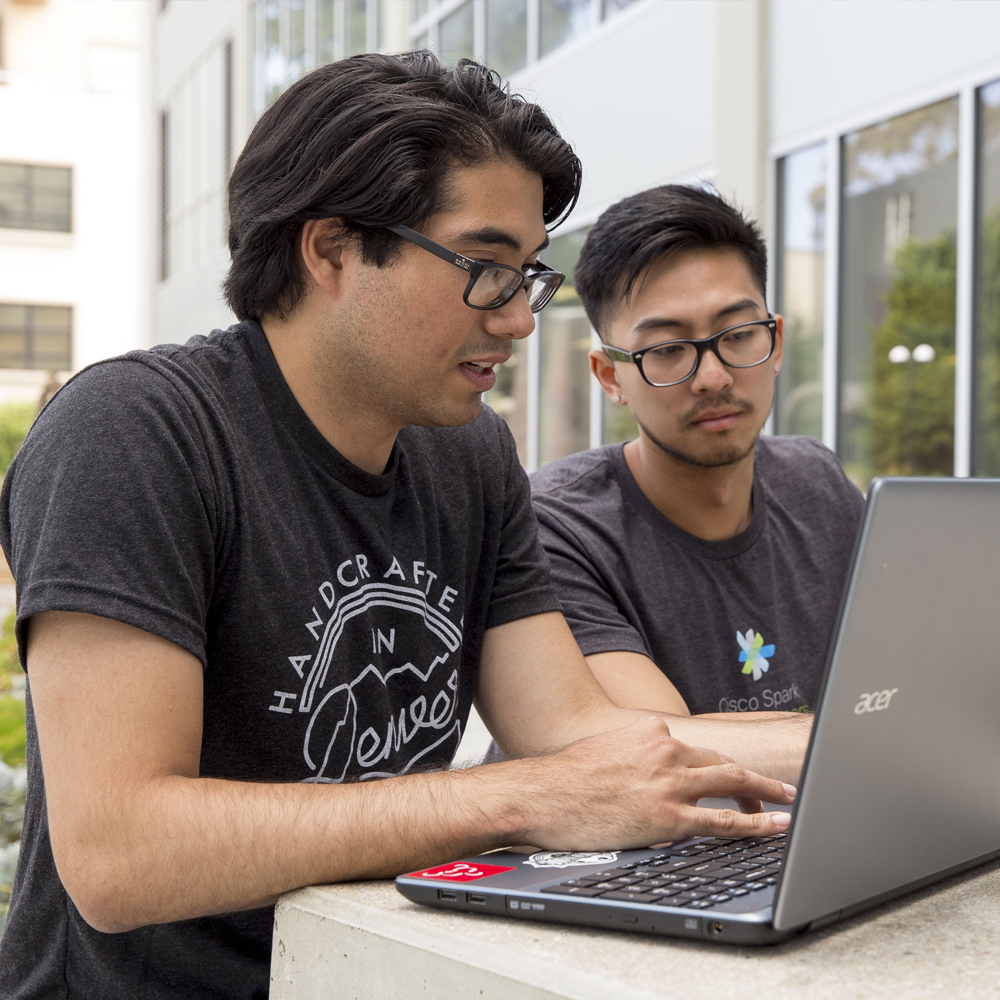 Two students working together on a project